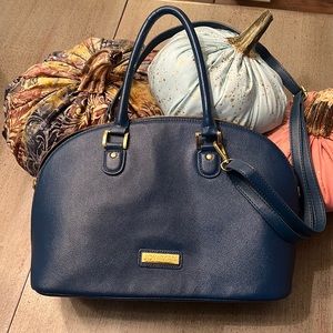 Light weight medium blue pebble leather with shoulder strap.